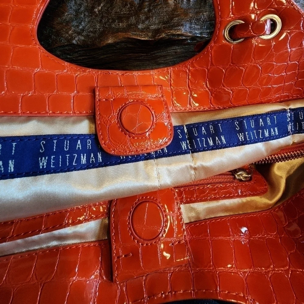 STUART WEITZMAN quilted tote with orange patent leather accents & gold hardware